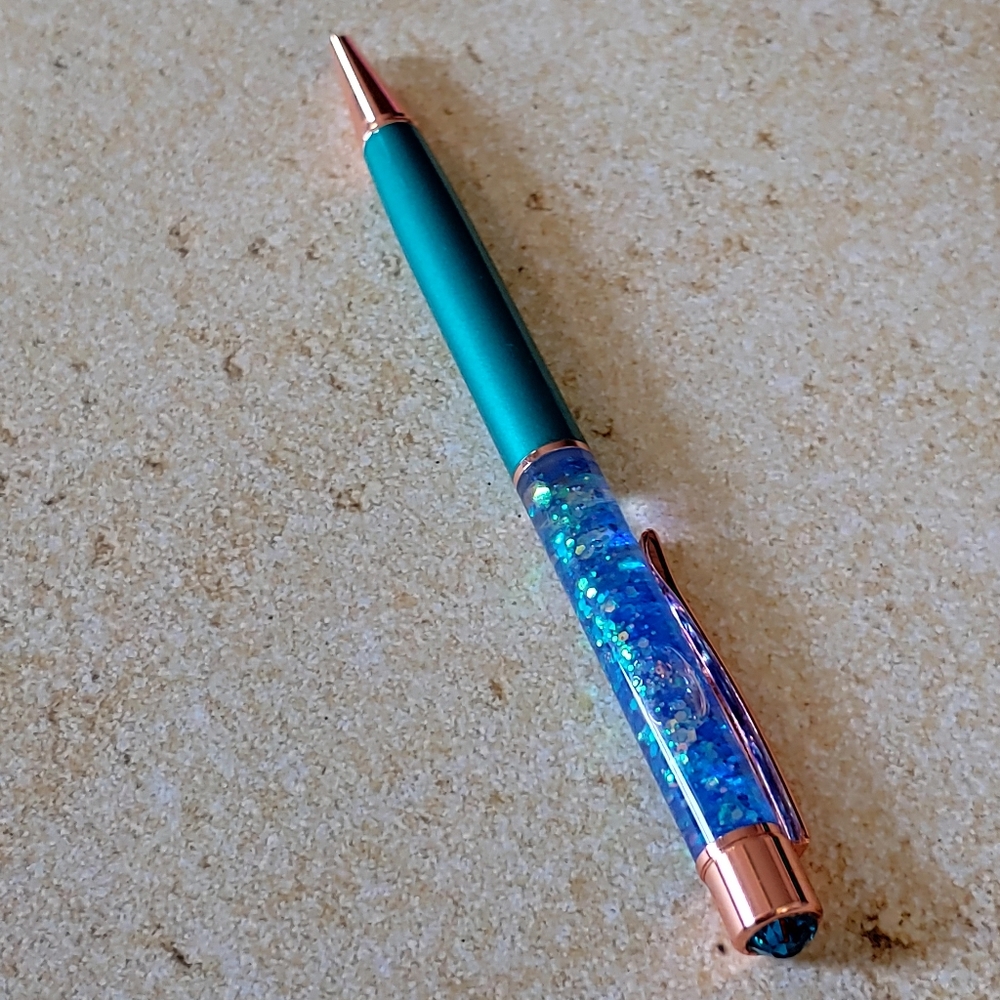 Teal and blue glitter pen